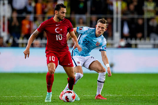 Hakan Calhanoglu of Turkey and Marcus Holmgren Pedersen of