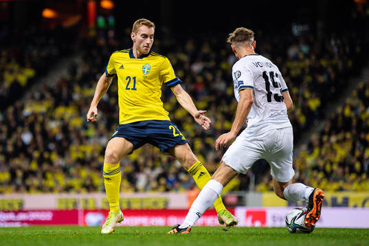 Dejan Kulusevski of Sweden and Mergim Vojvoda of Kosovo