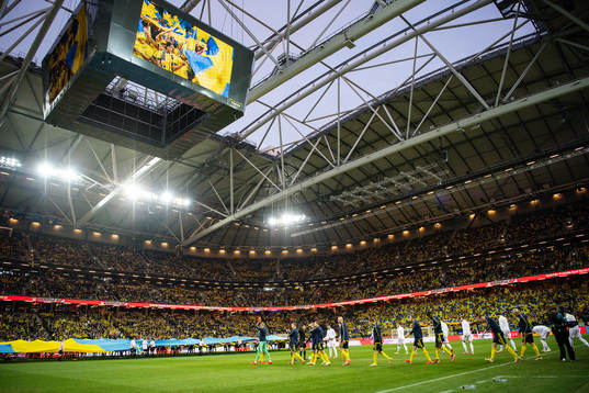 Players of Sweden and of Kosovo enters the pitch