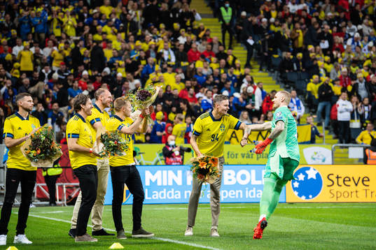 goalkeeper Robin Olsen with former players Sebastian