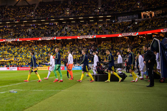 Players of Sweden and Kosovo enter the field for the FIFA