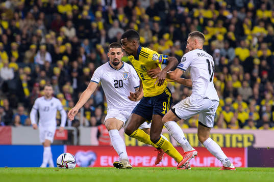 Ibrahim Dresevic and Florian Loshaj of Kosovo are being