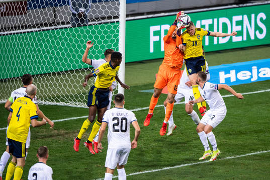 goalkeeper Arijanet Muric of Kosovo and Joakim Nilsson of