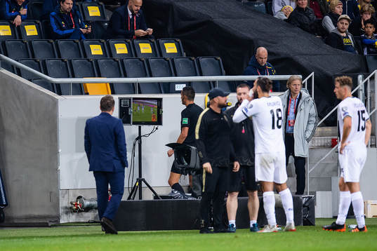 referee Marco Di Bello at the VAR screen