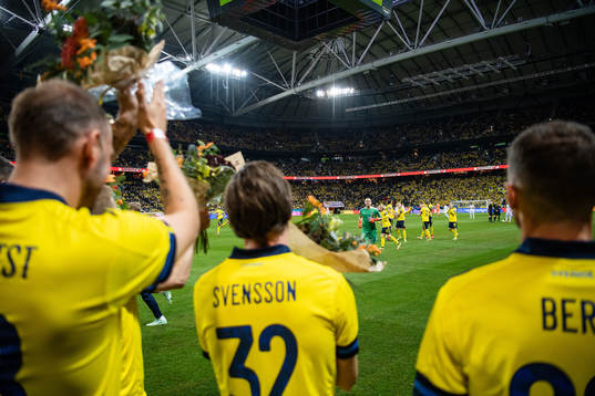 goalkeeper Robin Olsen with former players Sebastian