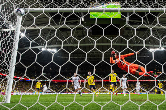 Goalkeeper Arijanet Muric of Kosovo sees Alexander Isak of