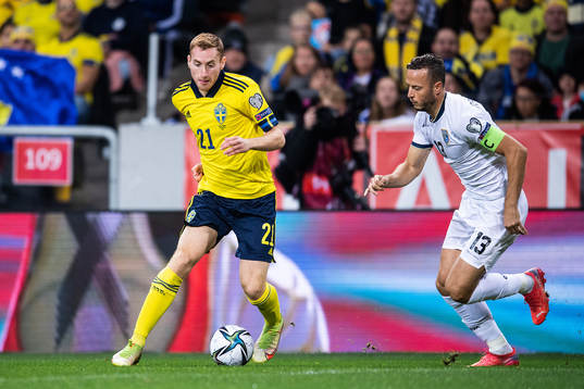 Dejan Kulusevski of Sweden and Amir Rrahmani of Kosovo