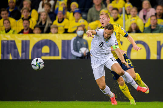Amir Rrahmani of Kosovo and Dejan Kulusevski of Sweden