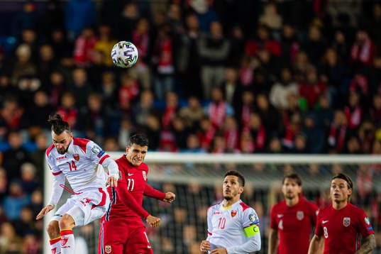 Marko Jankovic of Montenegro and Mohamed Elyounoussi of