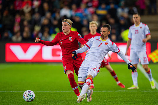 Jens Petter Hauge of Norway and Marko Vesovic of Montenegro