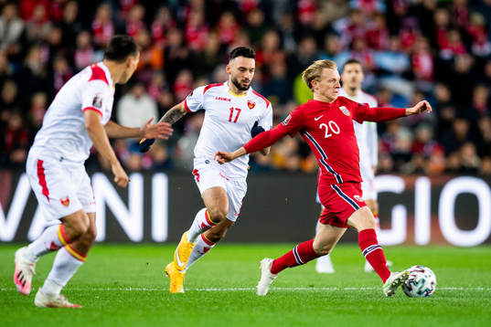 Sead Haksabanovic of Montenegro and Mats Møller Dæhli of