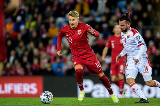 Martin Ødegaard of Norway and Marko Jankovic of Montenegro