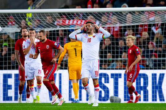 Stevan Jovetic of Montenegro looks dejected