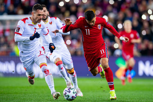 Marko Vesovic of Montenegro and Mohamed Elyounoussi of