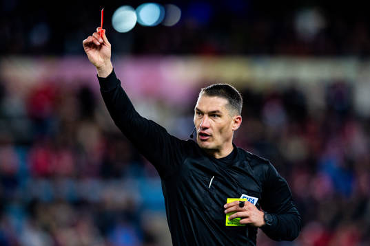 Istvan Kovacs, referee, shows a red card