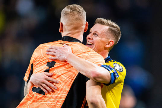 Goalkeeper Robin Olsen and Emil Krafth of Sweden celebrate