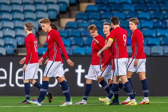 Tobias Christensen of Norway with team mates celebrates