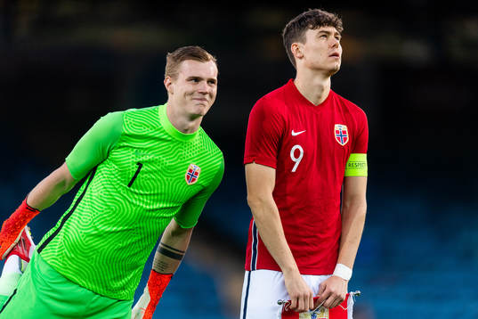 Goalkeeper Kristoffer Klaesson and Jørgen Larsen of Norway