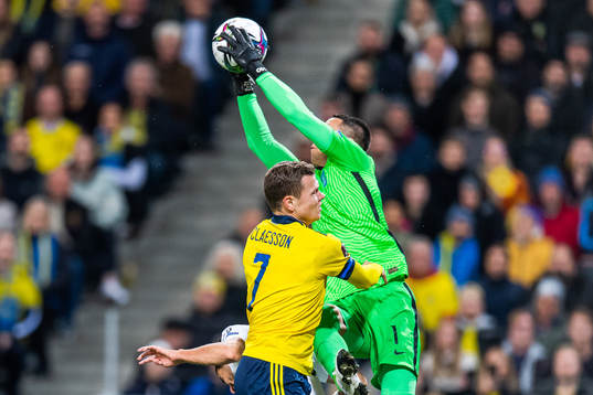 Viktor Claesson of Sweden and goalkeeper Odisseas