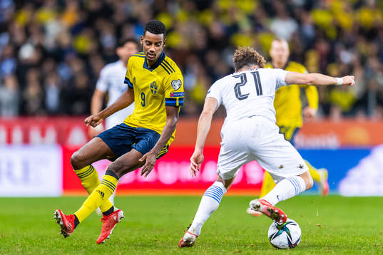 Alexander Isak of Sweden and Kostas Tsimikas of Greece