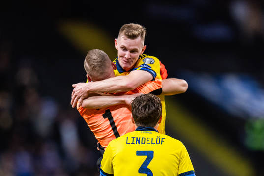 Victor Nilsson Lindelöf watch as goalkeeper Robin Olsen