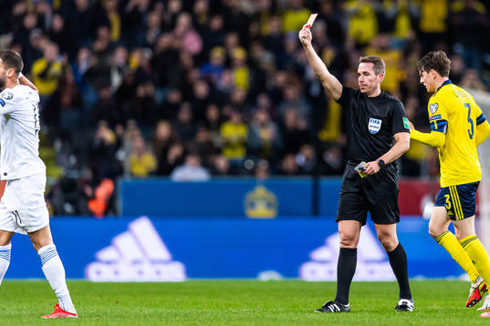 Pantelis Chatzidiakos of Greece receivesa red card from