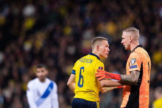 Ludwig Augustinsson and goalkeeper Robin Olsen of Sweden