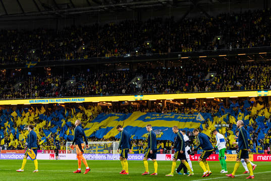 Players of Sweden enter the pitch