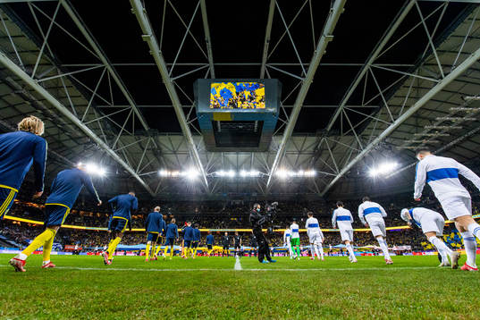 Players of Sweden and Greece enter the pitch