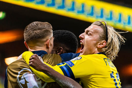 Alexander Isak celebrates with Emil Forsberg of Sweden
