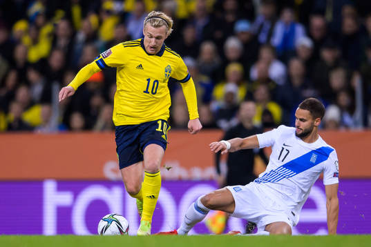 Emil Forsberg of Sweden and Pantelis Hatzidiakos of Greece