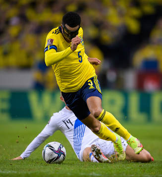 Martin Olsson of Sweden in action against Dimitris Pelkas