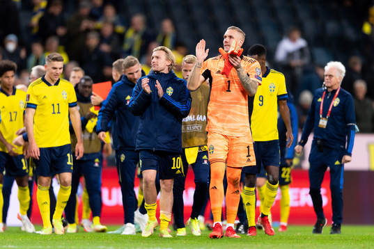Emil Forsberg and goalkeeper Robin Olsen celebrate