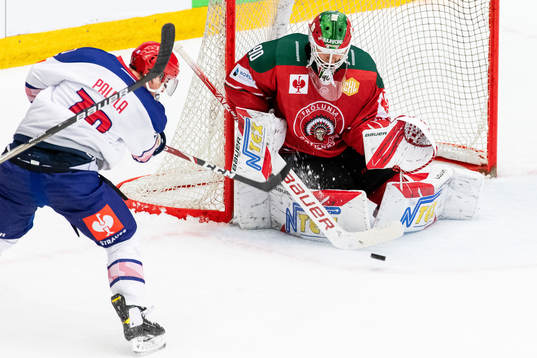 Olli Palola of Helsinki with a shot against goalkeeper