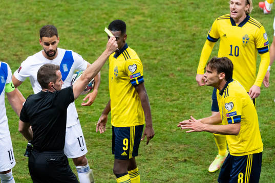 Albin Ekdal of Sweden receives a yellow card