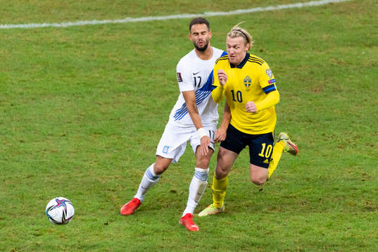 Pantelis Hatzidiakos of Greece in action with Emil Forsberg