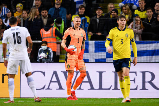 goalkeeper Robin Olsen of Sweden in pain