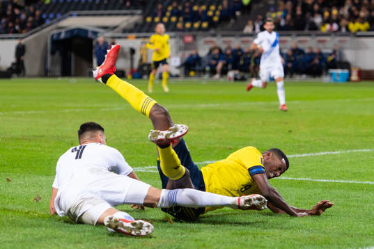 Konstantinos Mavropanos of Greece in action with Alexander