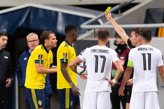 Albin Ekdal of Sweden receives a yellow card