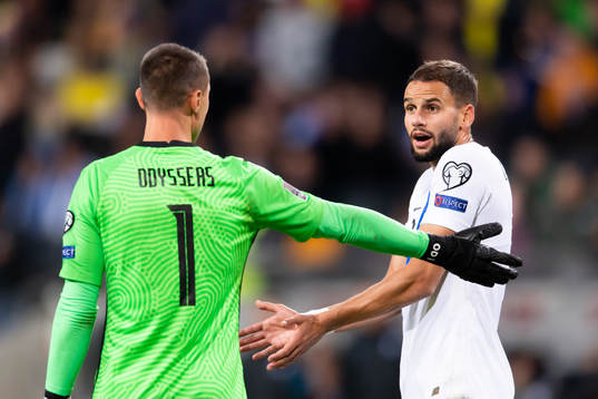 Goalkeeper Odisseas Vlachidimos and Tasos Bakasetas