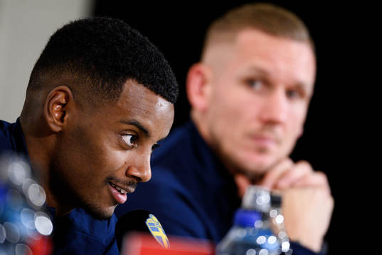 Alexander Isak and goalkeeper Robin Olsen of Sweden