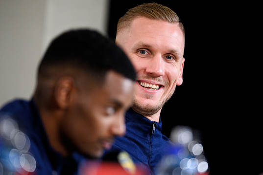 Alexander Isak and goalkeeper Robin Olsen of Sweden