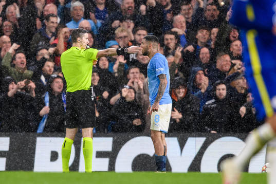 Referee François Letexier in a discussion with Sergio Pena