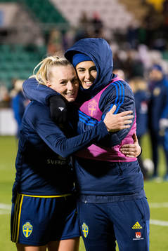 Stina Blackstenius and goalkeeper Zecira Musovic of Sweden