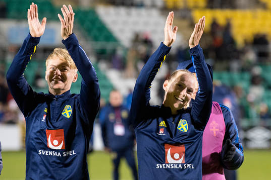 Nilla Fischer and Stina Blackstenius of Sweden celebrate
