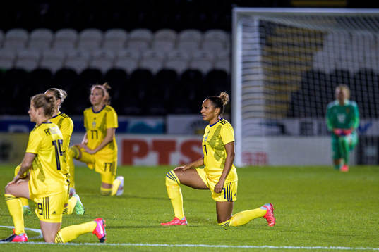 Madelen Janogy of Sweden takes a kneel