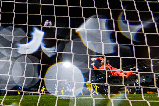 Fridolina Rolfö of Sweden scores 0-1 behind goalkeeper