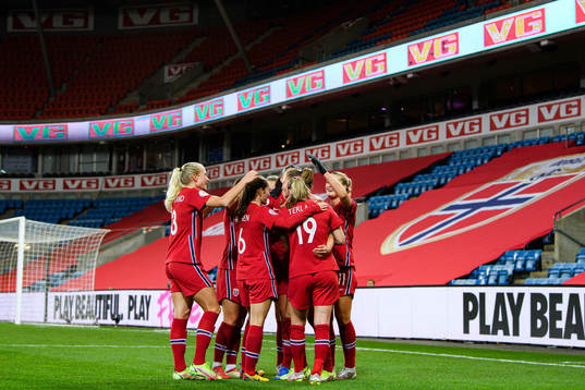 Players of Norway celebrate with Caroline Graham Hansen