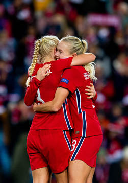 Maria Thorisdottir and Guro Bergsvand of Norway celebrate