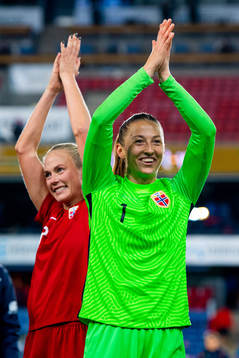 Guro Bergsvand and goalkeeper Cecilie Fiskerstrand of